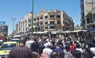 فئات داعمة للحكومة السورية تتوسع حول المؤسسات الحكومية في السويداء