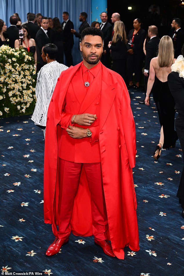 Rege-Jean Page wore an all-red suit and duster coat; the Bridgerton star's shoes were also red