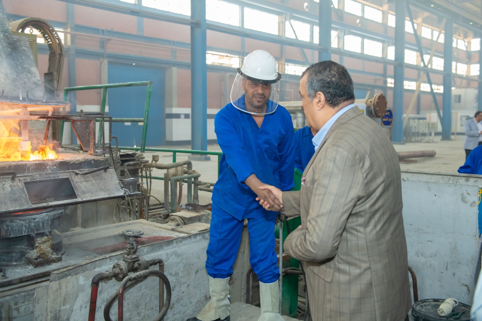 May be an image of 3 people and foundry