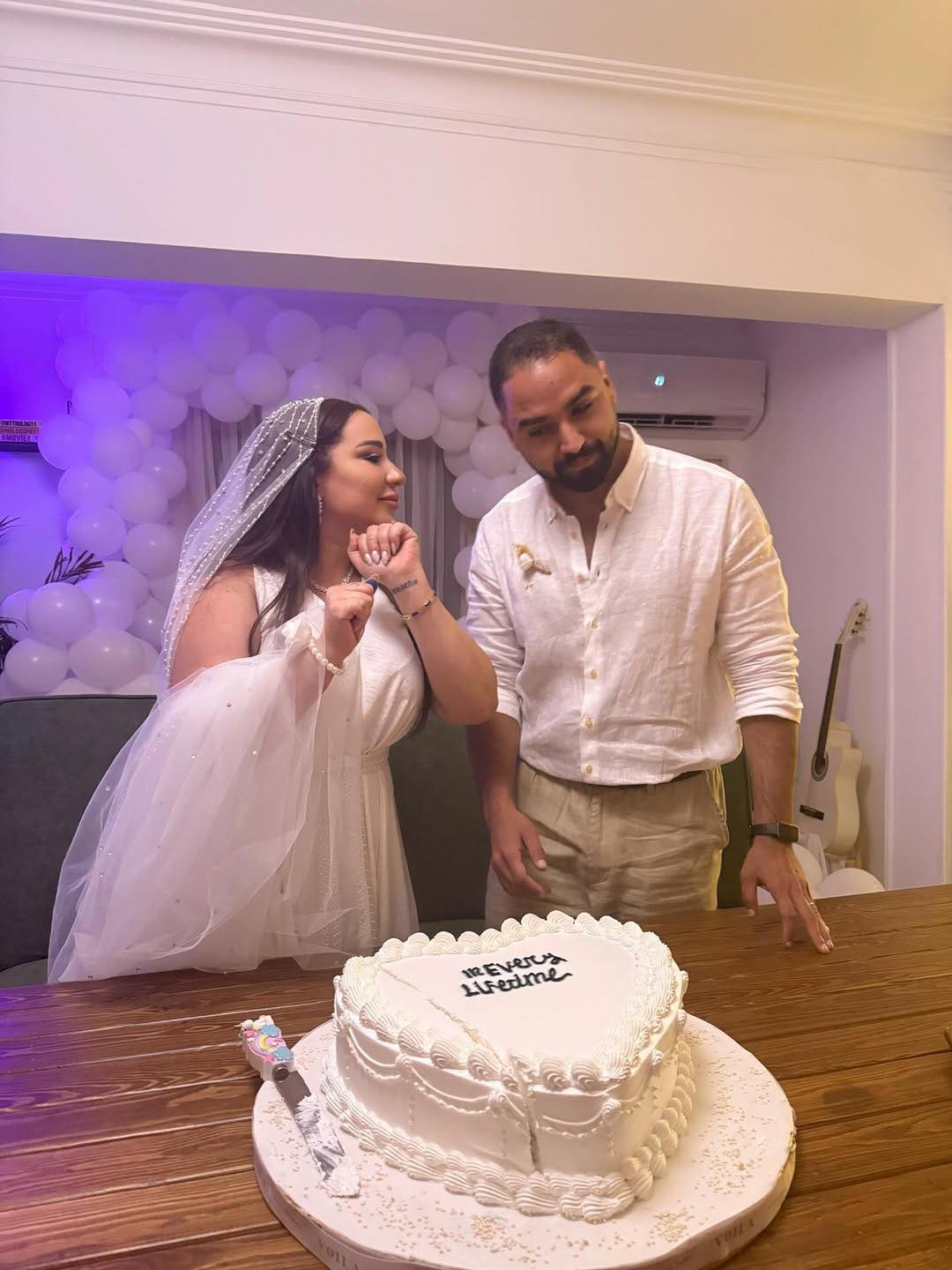 May be an image of 2 people, wedding cake and wedding