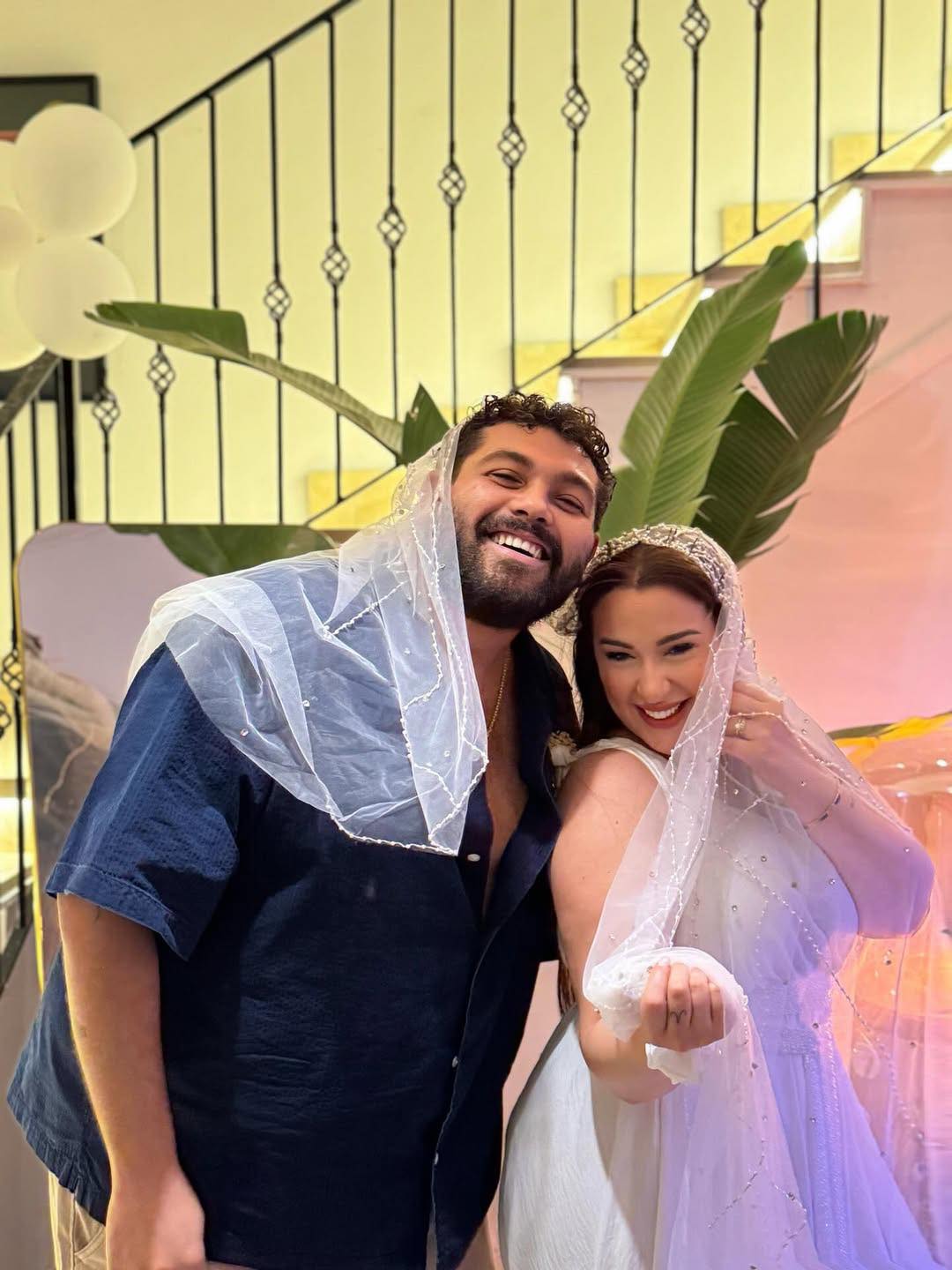 May be an image of 2 people and wedding